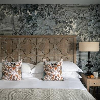 A Classic King room at the Kensington Hotel in London, beautifully refurbished with elegant blue accents.