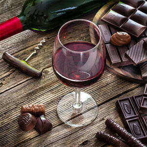 Glass of red wine with luxury chocolates