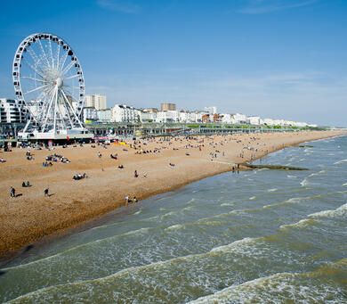 Brighton beach on a summer's day with ferris wheel