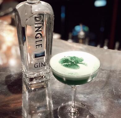 St. Patrick's Day cocktail with a bottle of Dingle Gin