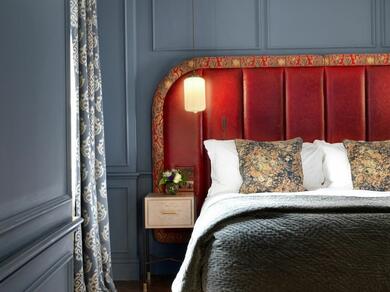Bed with red headboard in The Bloomsbury